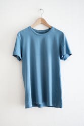 Blank blue T-Shirts are laminated using thermoplastic and reactive hot melt adhesives